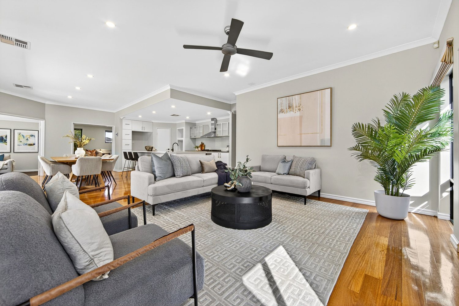 Open-plan living, dining and kitchen of a Perth home presented for sale